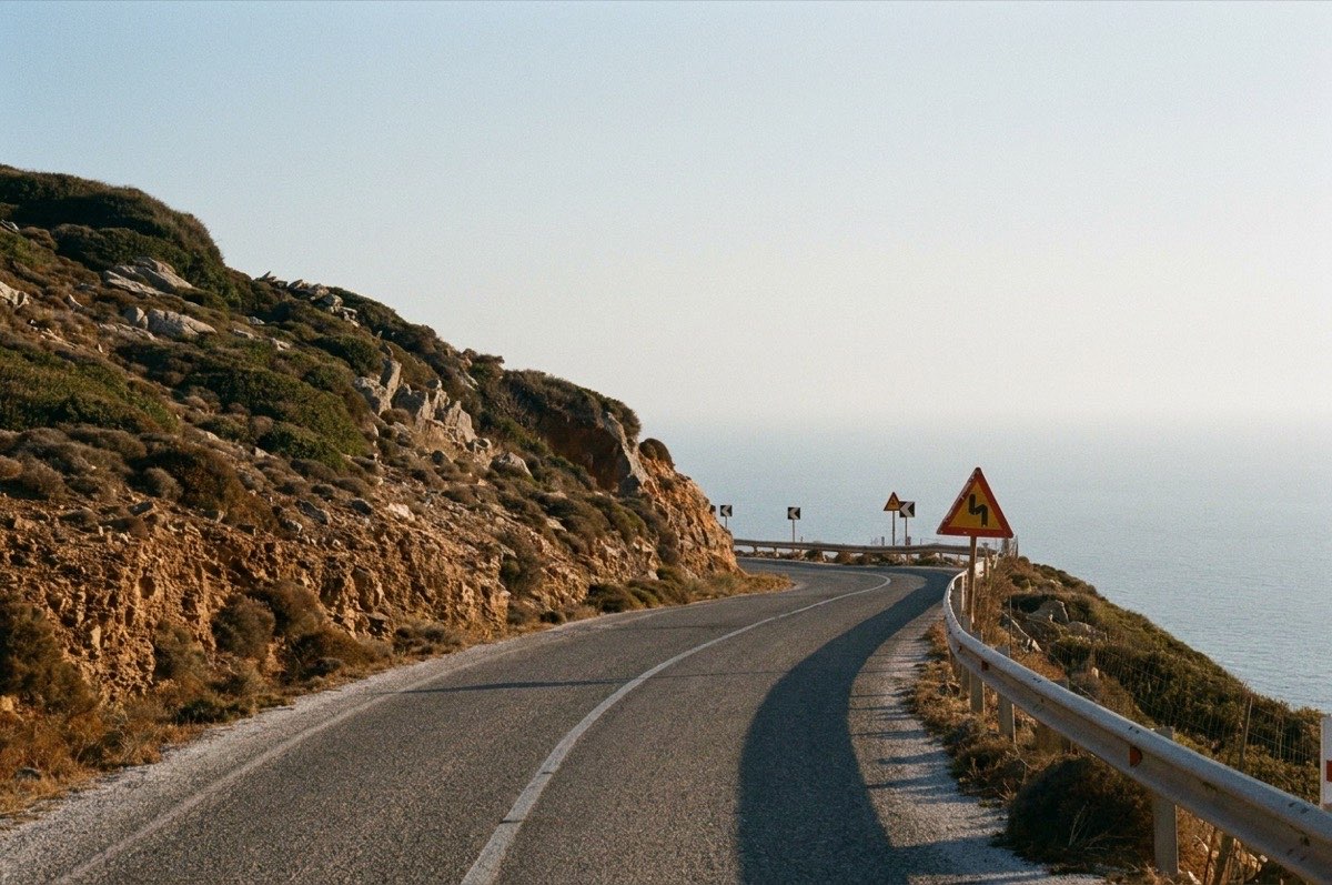 A winding coastal road high above the sea